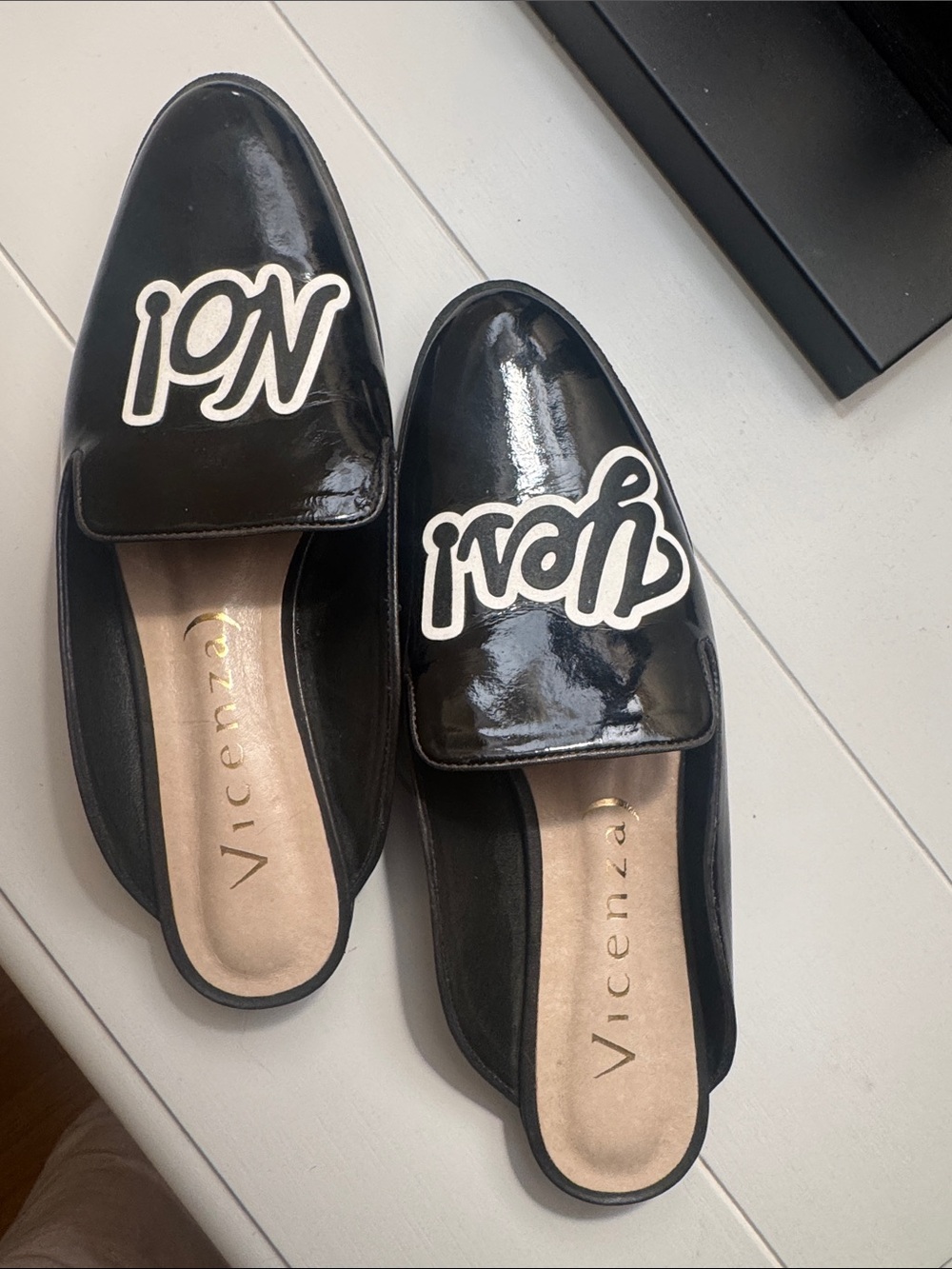 Vicenza Black Patent Slip-On Mules with White Script Accent